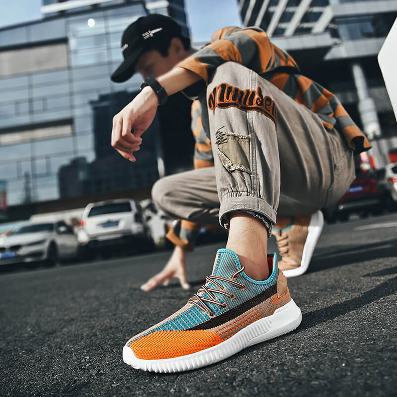 Lätta orange damskor, sportiga sneakers för en bekväm vardag.