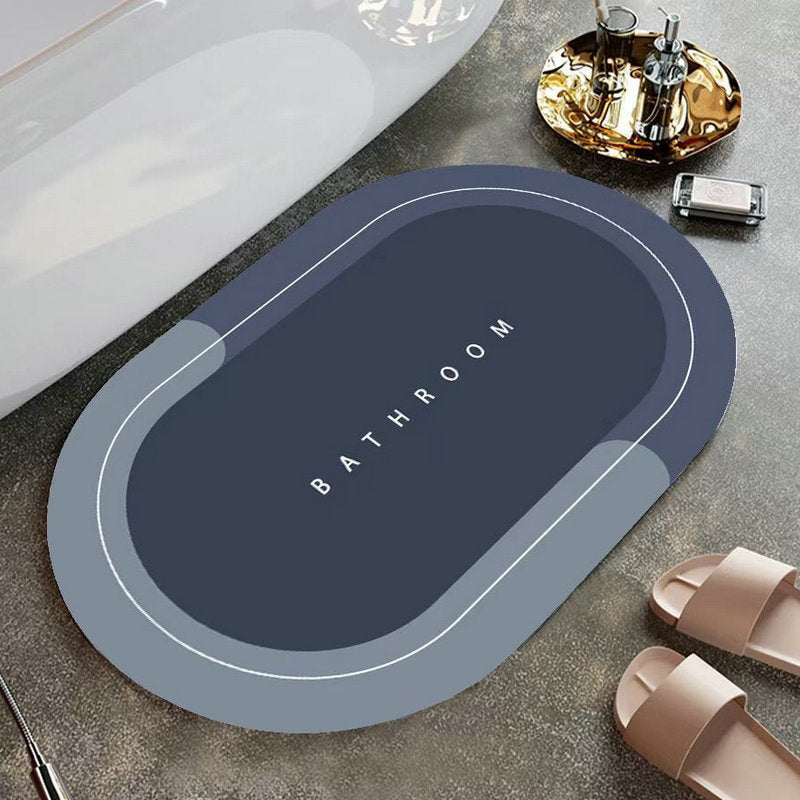 Elegant grå oval nappa golvmatta med halkfri baksida, snabbtorkande för badrum eller kök.