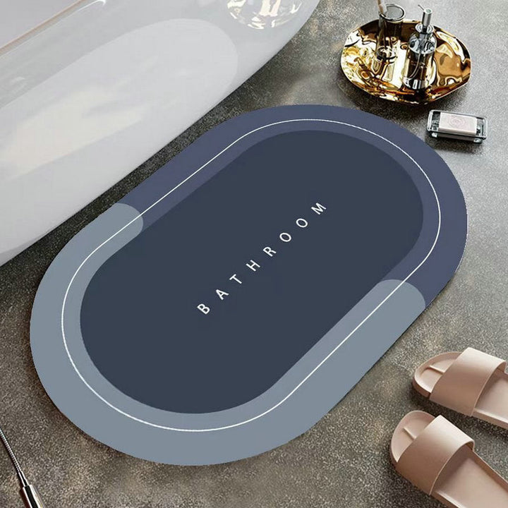Elegant grå oval nappa golvmatta med halkfri baksida, snabbtorkande för badrum eller kök.