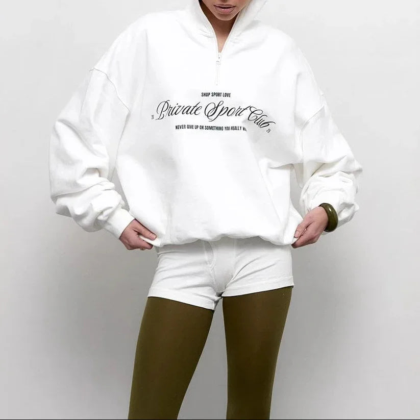 Trendig dam sweatshirt med bekväm oversized passform, halv dragkedja & djärvt bokstavstryck för vårmode.