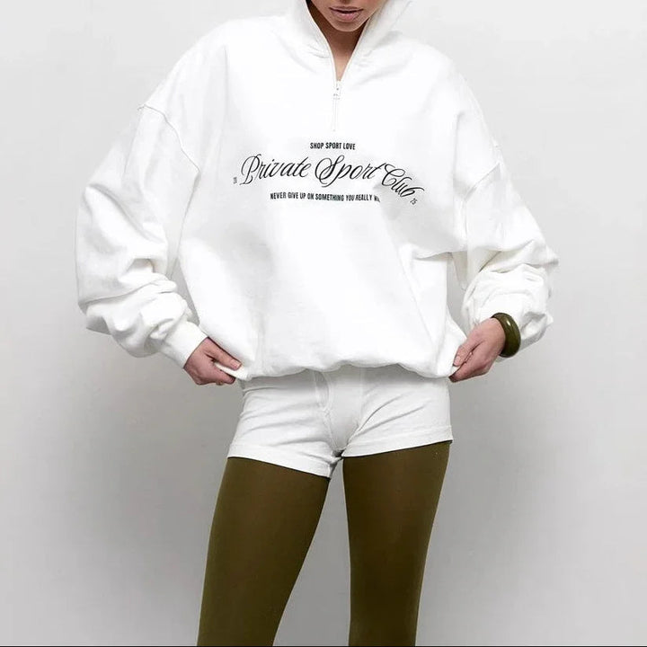 Trendig dam sweatshirt med bekväm oversized passform, halv dragkedja & djärvt bokstavstryck för vårmode.