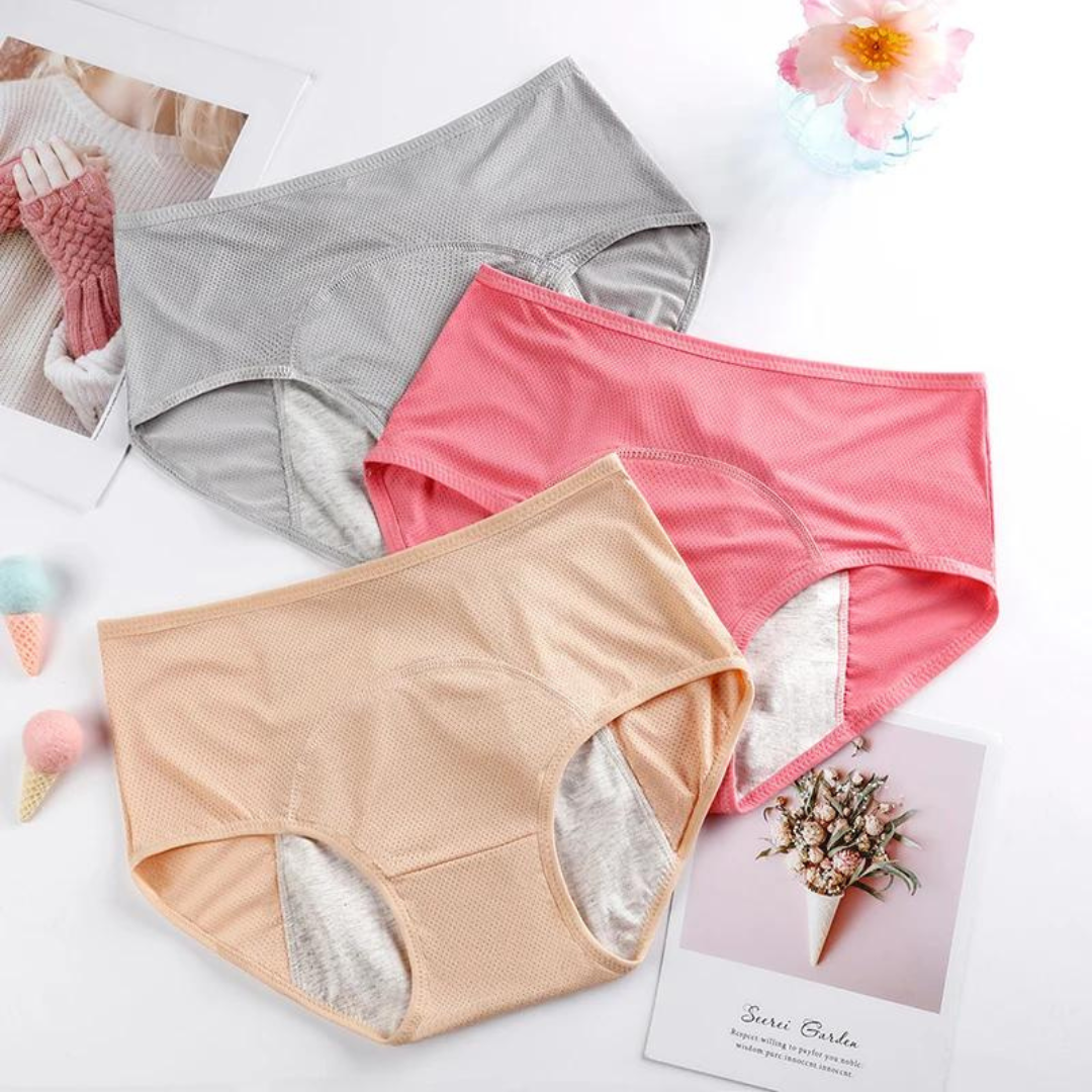 Flera plus size menstruationstrosor, vikta. Hållbara, återanvändbara damunderkläder med läckagesäkert skydd.