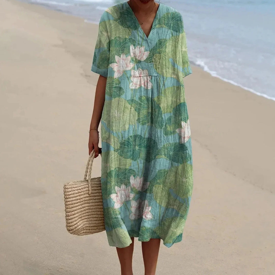 Damklänning plus size, blommig skjortklänning med kort ärm för en snygg sommarlook.