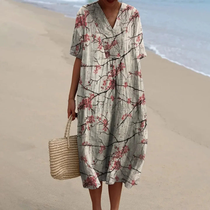 Bekväm plus size damklänning, blommig skjortklänning med kort ärm och praktiska fickor.