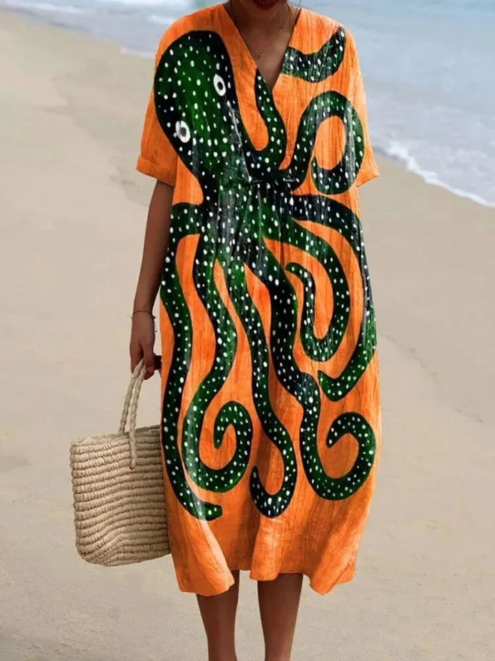 Plus size damklänning med fickor, kortärmad sommarklänning. Bekväm och mönstrad.