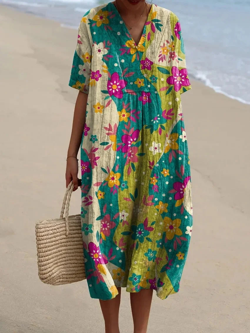 Mönstrad plus size sommarklänning för damer, kortärmad med fickor. Bekväm och luftig stil.