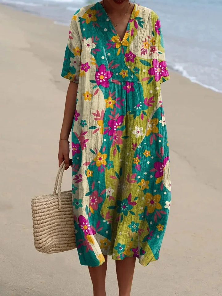 Mönstrad plus size sommarklänning för damer, kortärmad med fickor. Bekväm och luftig stil.