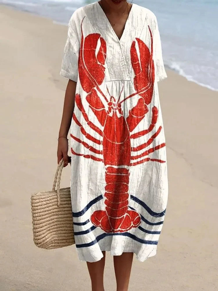 Kvinnors plus size klänning, kortärmad med fickor. Bekväm sommarklänning i mönstrad design.