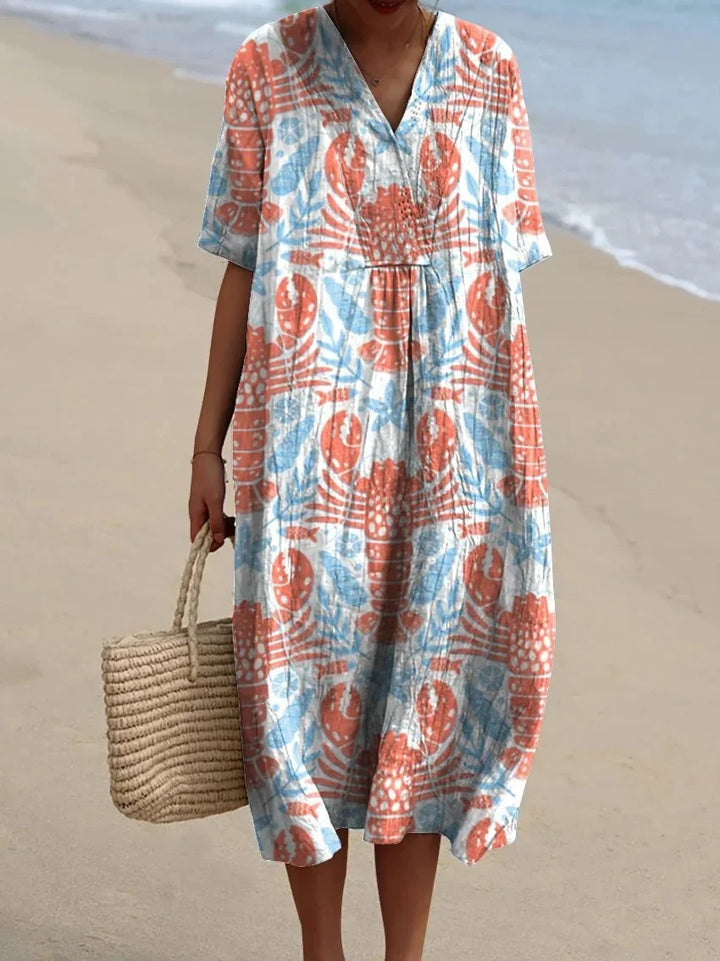Elegant plus size sommarklänning, kortärmad, med fickor. Marint mönster för damer.