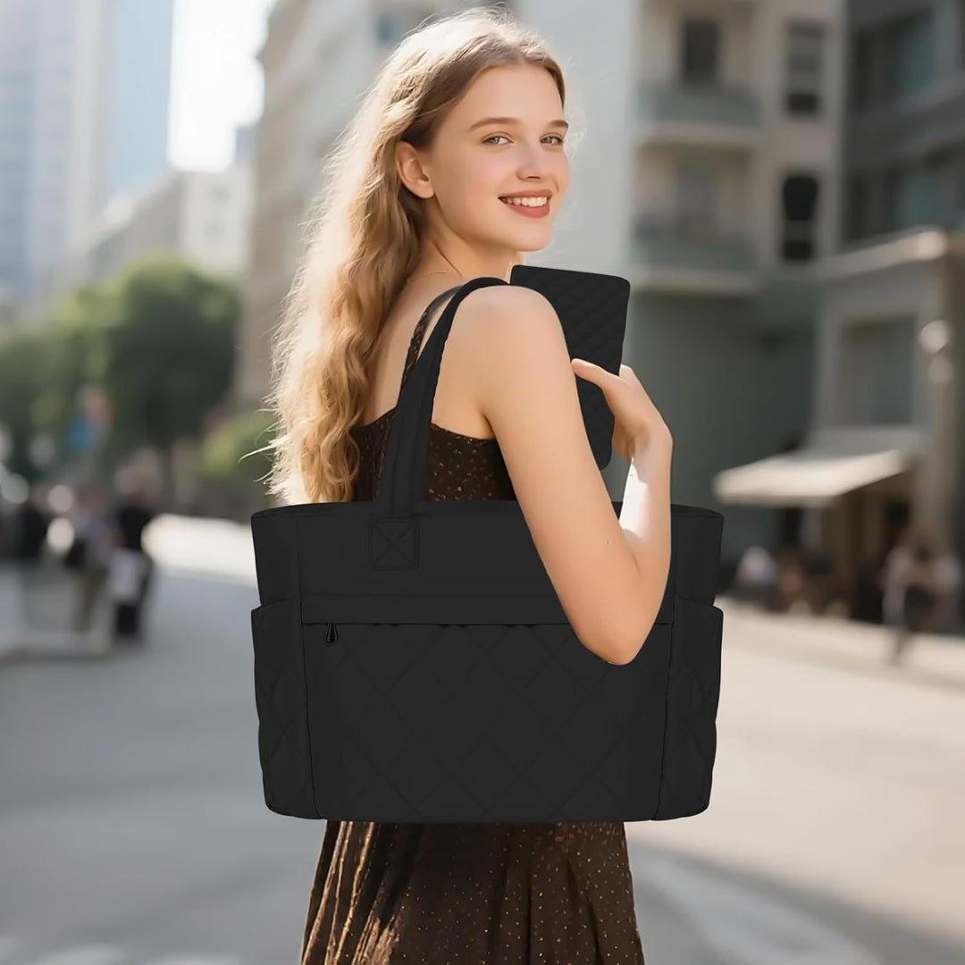 Öppen Selvara arbetsväska som visar alla fack, organiserad damväska med stor kapacitet för laptop.