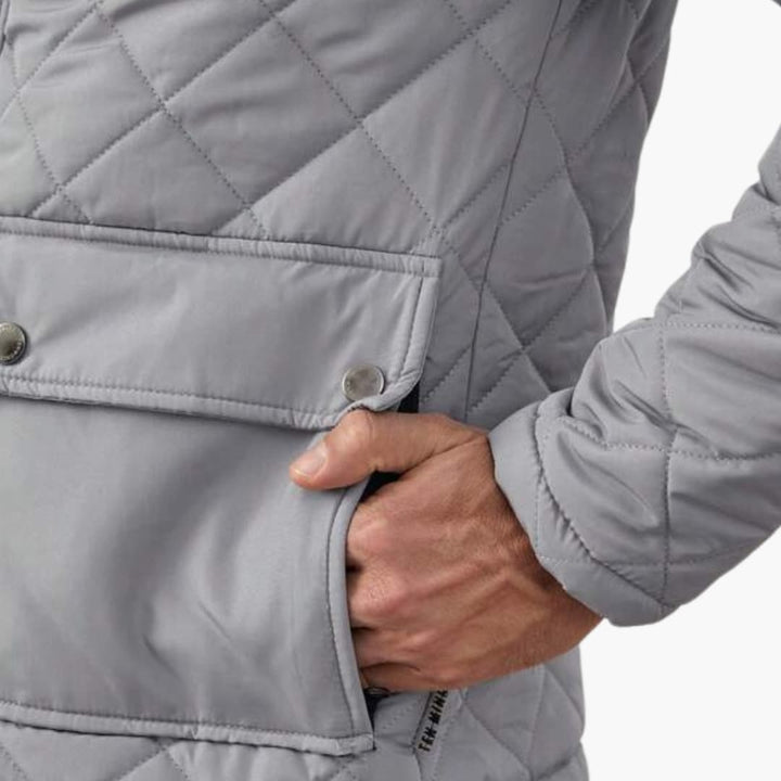 Mångsidig quiltad herrjacka med stativkrage, idealisk som varm vinter- eller trendig höstjacka.