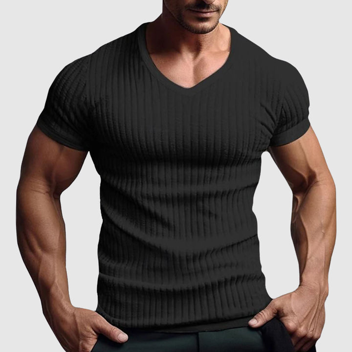 Slim fit randig t-shirt för män. Vit med svarta ränder, idealisk som basplagg eller fest t-shirt.
