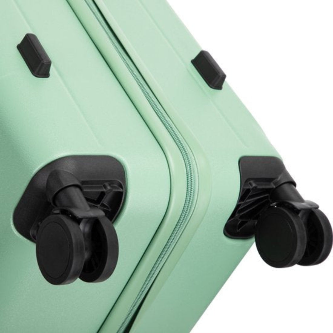 Resväskset med hårdskal, 360-hjul och laptopfack, smidigt rullande på flygplatsen.