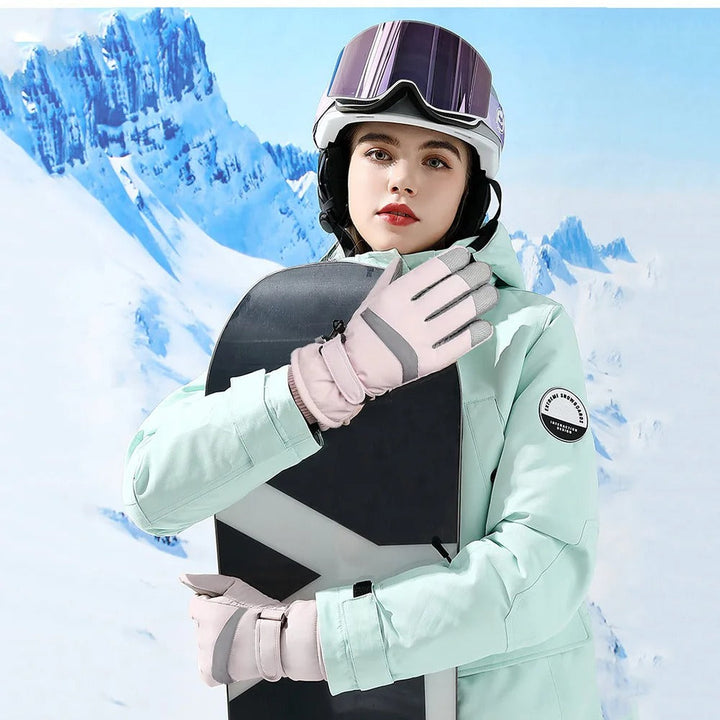 Rosa skidhandskar för dam, termiska och vattentäta, perfekta för kalla backar.