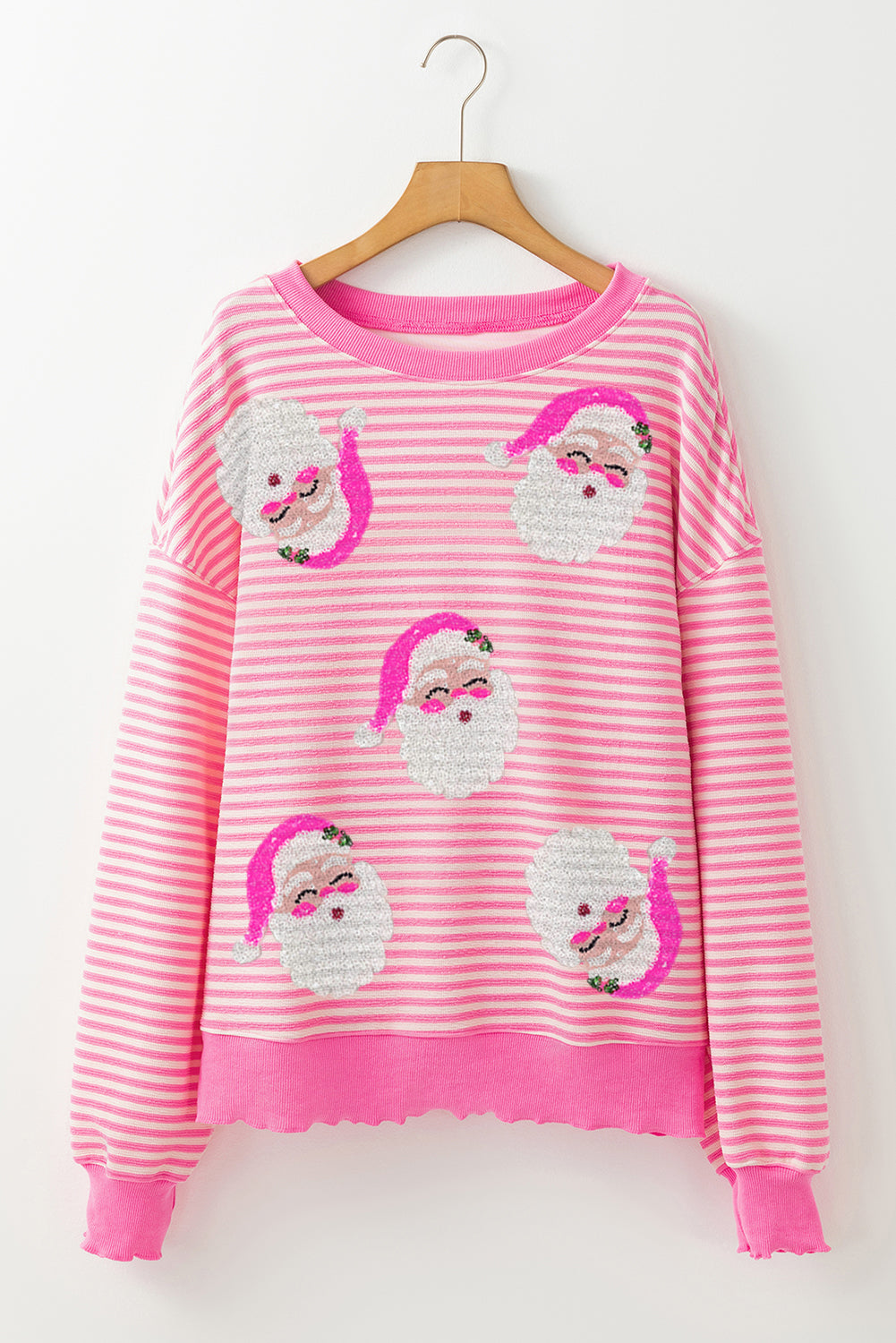 Rosa randig långärmad jultopp för damer. Bekväm med Santa Claus tryck, idealisk för vinter och fest.