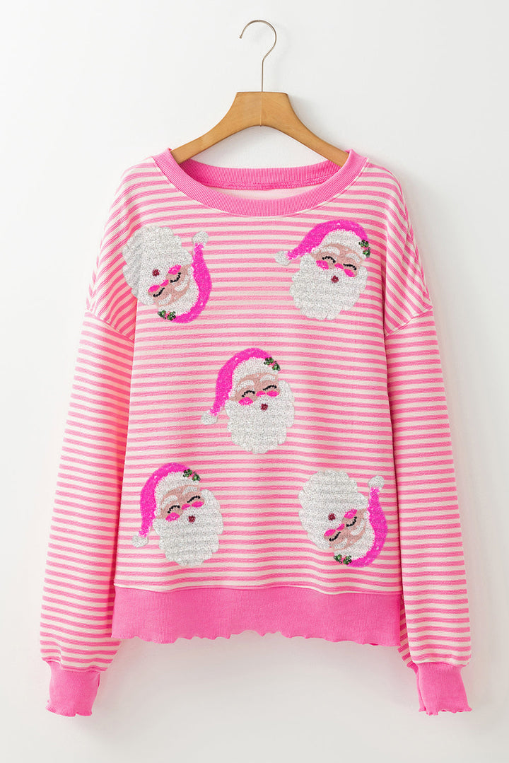 Rosa randig långärmad jultopp för damer. Bekväm med Santa Claus tryck, idealisk för vinter och fest.