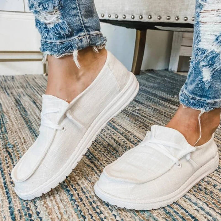 Par av lätta rosa rutiga canvas loafers för damer, perfekt sommar- och fritidssko