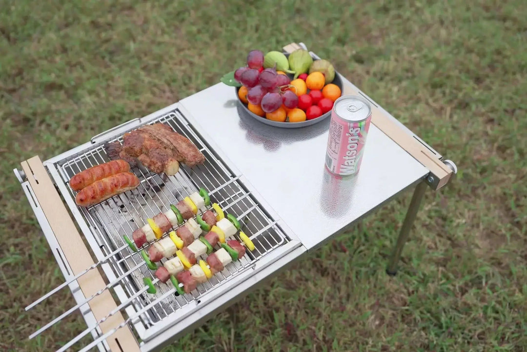 Modern hopfällbar bärbar grill i rostfritt stål för utomhusmatlagning, camping och picknick.