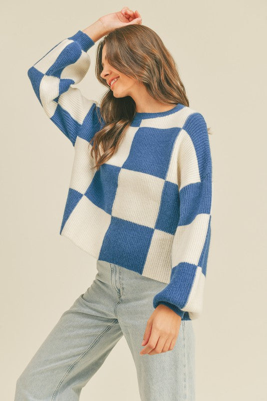 Trendig rutig oversized dam pullover för vintermode. Stilfull, bekväm, långärmad stickad tröja i kvinnorsmode.