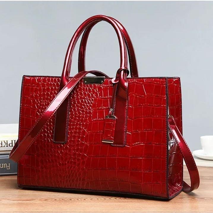 Chic damväska med lyxigt krokodiltryck. Elegant totebag och moderiktig accessoar för vardagen.