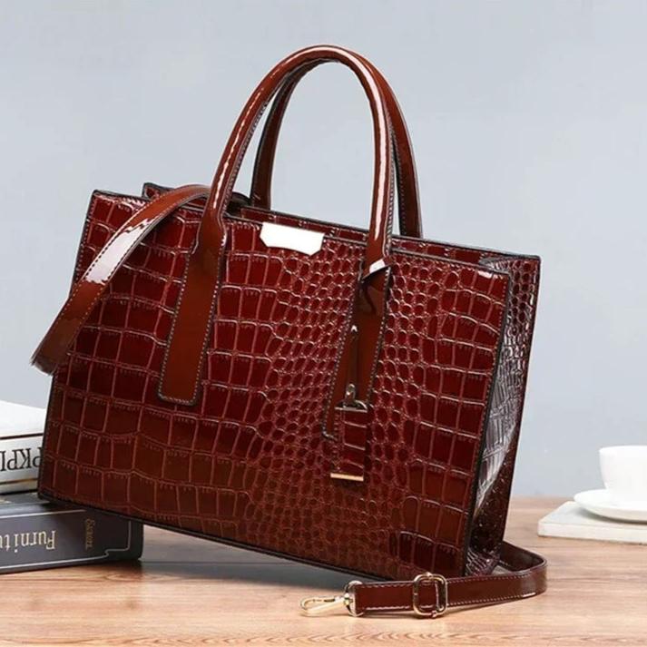 Mångsidig toteväska dam, med exklusivt krokodiltryck. Kan bäras som rymlig handväska eller crossbody.