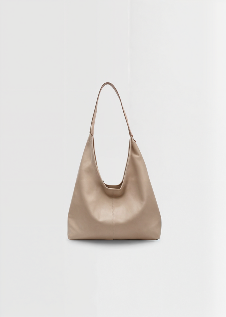 Stilren vintage-inspirerad damväska tote i veganläder, en elegant och rymlig handväska för kvinnor.