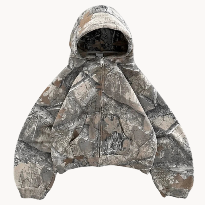 Stilren kamouflage hoodie för män i rymlig modell, perfekt som överdel för aktiv eller avslappnad stil.