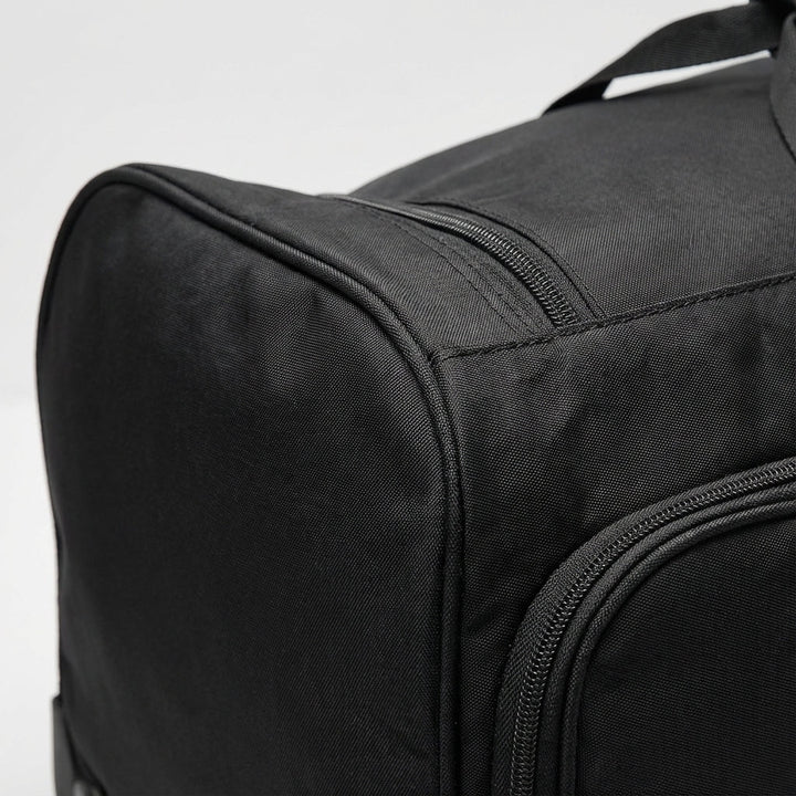 Stor hjulväska i slitstarkt Oxford-tyg, idealiskt bagage för långa resor och omfattande packning.