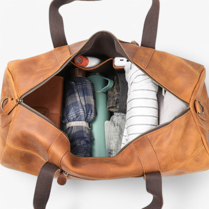 Unisex axelväska i elegant design. En rymlig duffelväska för stilfulla korta resor och weekendäventyr.
