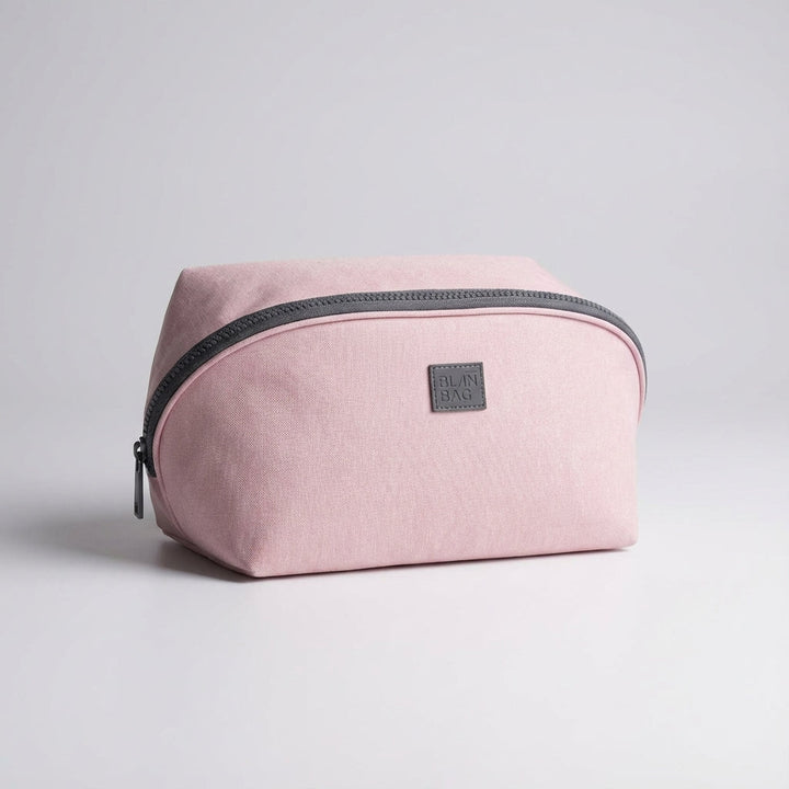Rosa Packify necessär, perfekt för smidig reseförvaring av hygienartiklar. Kompakt organiseringspåse för packning.