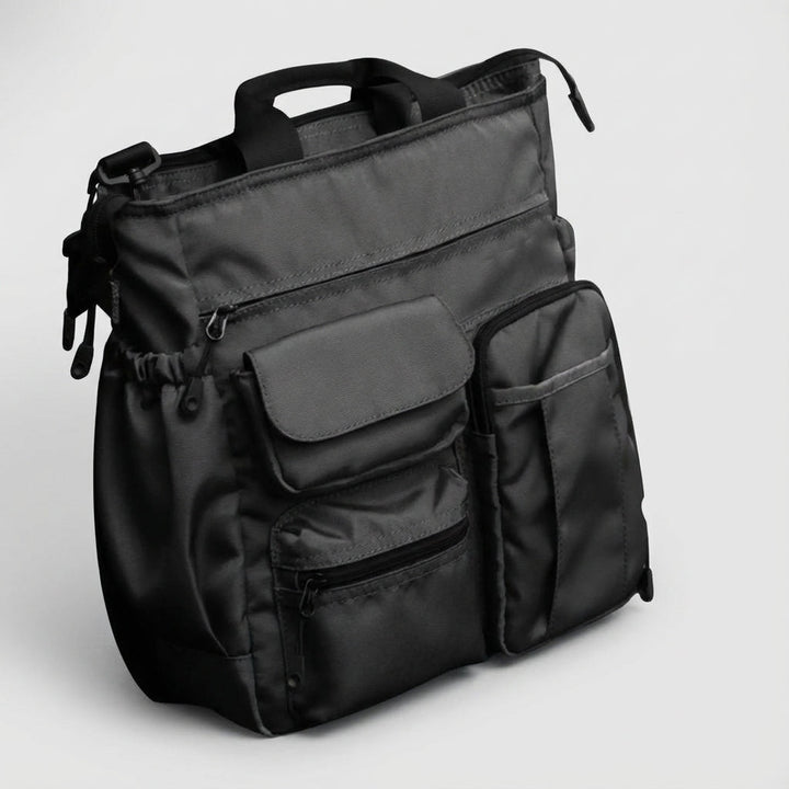Rymlig arbetsväska/organisationsväska med laptopfack och axelrem, idealisk för affärsdokument.