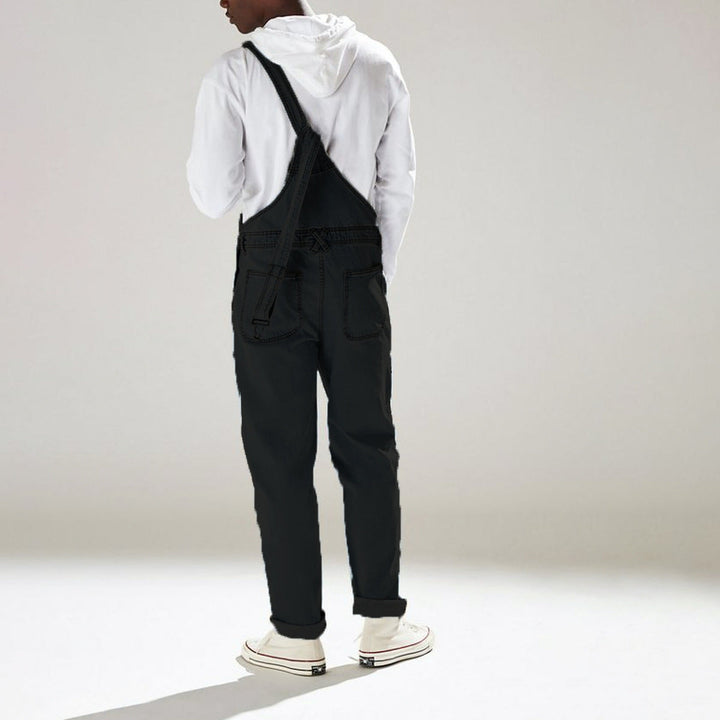 Funktionell utilityoverall med rymliga fickor, slitstark unisex jumpsuit för streetwear mode.