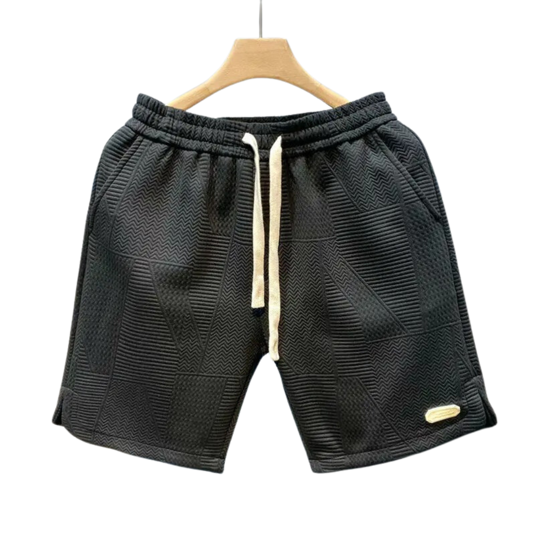 Sportshorts för män med svart-vitt vågmönster. Bekväma träningsshorts, perfekta för löpning och fritid.