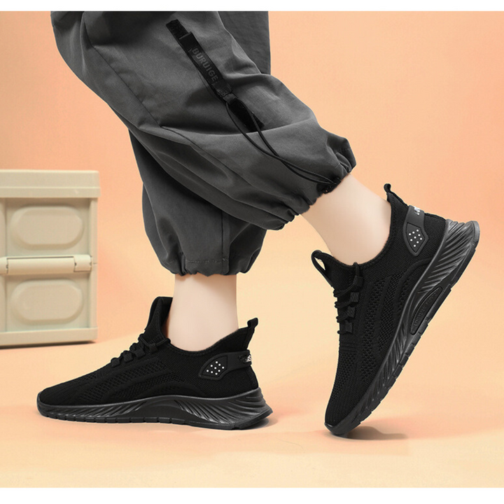 Kvinnors lätta stickade sneakers i nät, bekväma och luftiga promenadskor för vår och sommar.