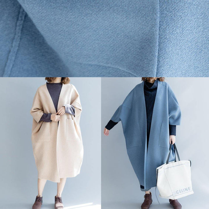 Mångsidig damkappa i lång modell med bekväm lös passform och eleganta batwing ärmar. Perfekt ytterplagg.