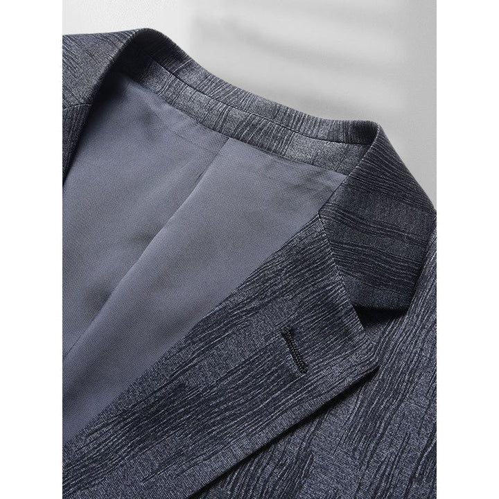 Snygg grå slim fit herrblazer för formella event och affärer. Skrynkelfri design, modern komfort.
