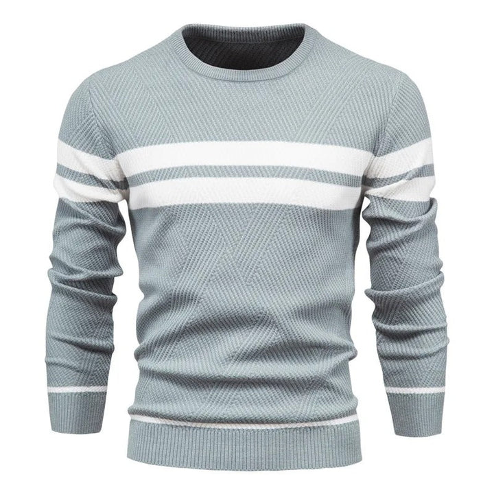 Patchwork-pullover för herr med rund hals. Elegant och unik design för vardagsbruk.