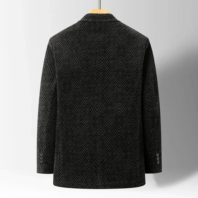 Varm och elegant vinterjacka för män med skräddarsydd design och diskret texturerat mönster. Perfekt höstjacka.