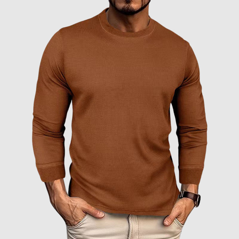Herrskjorta med klassisk stickad design och hög krage, perfekt för en stilren och bekväm fritidslook.