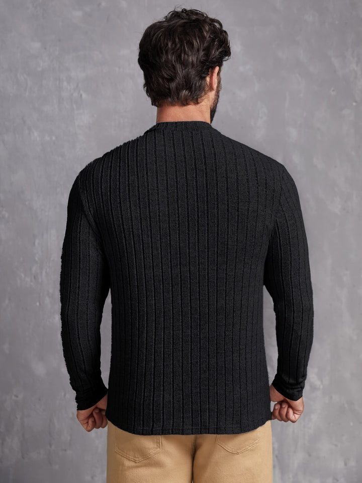 Modern crewneck herrtröja i avslappnad passform. En stilren vardagströja som kombinerar komfort och mode.