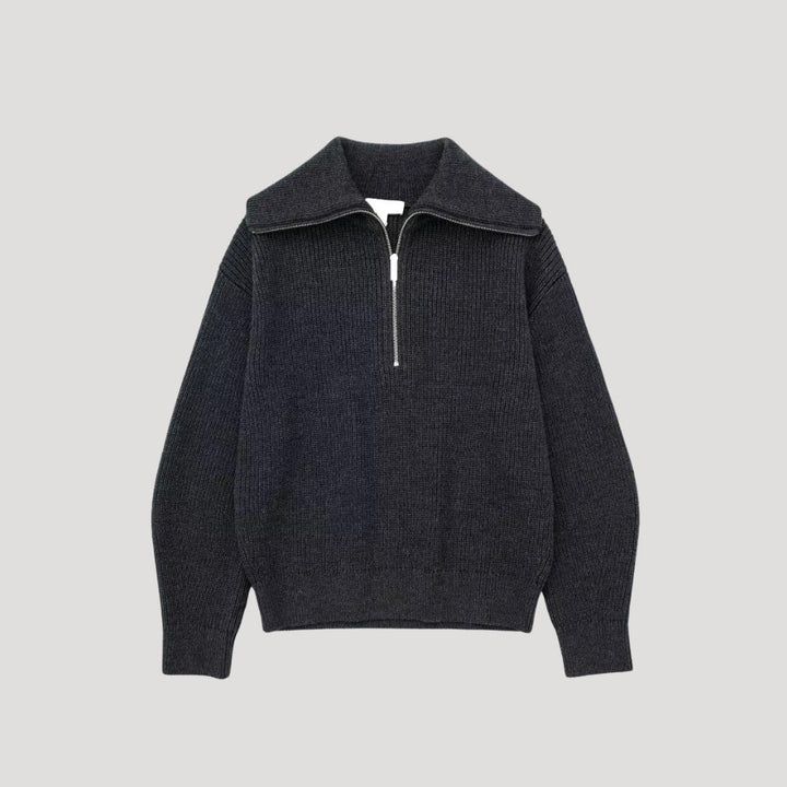 Ryggsida på stilren ribbad stickad tröja för dam, perfekt för en bekväm och modern look.