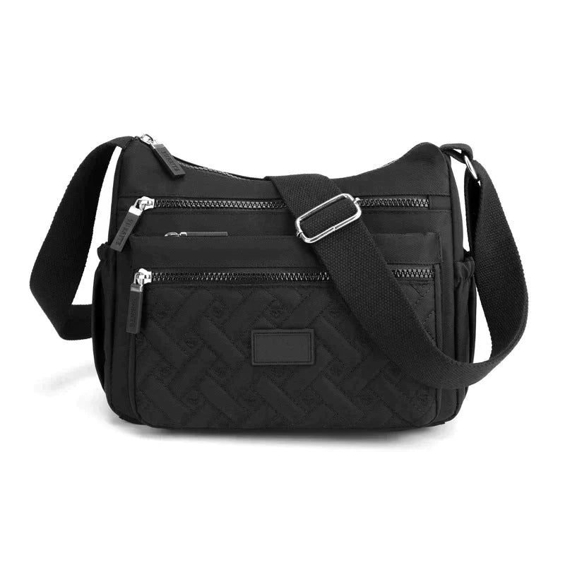 Elegant kvinnors crossbody axelväska, perfekt för handsfree-bekvämlighet och en organiserad vardag.