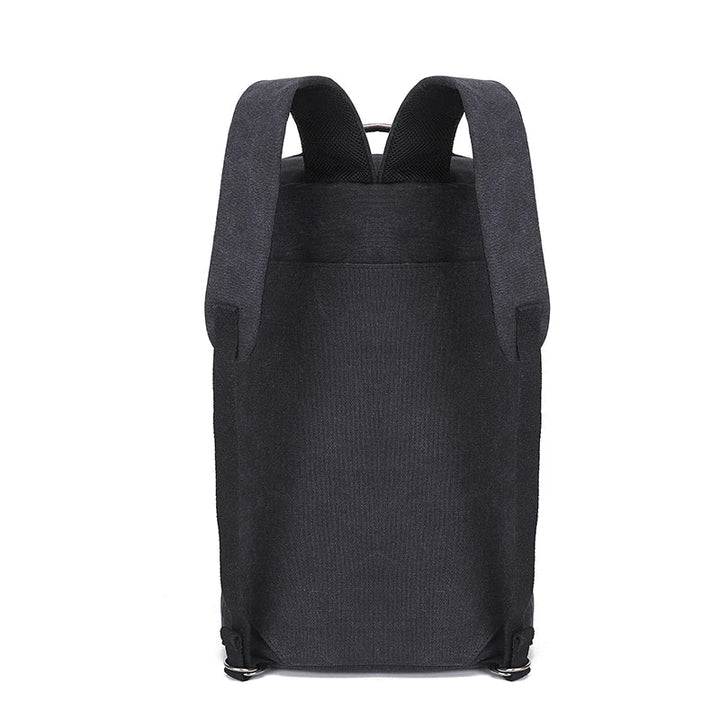 Unisex canvasryggsäck TrailHaven med stor kapacitet i grått, packad för resa, redo för äventyr och funktion.