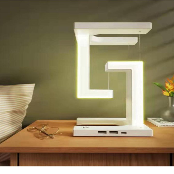 Innovativ svävande LED-skrivbordslampa; en modern gadget och perfekt presenttips med USB-laddning.