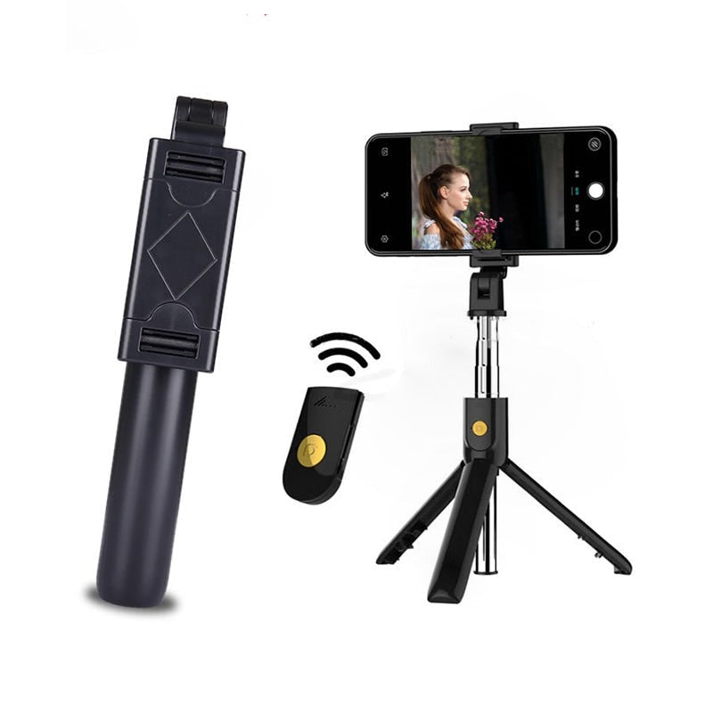 Svart Bluetooth selfiepinne med integrerat stativ och mobilfäste för stabila foton och videor.