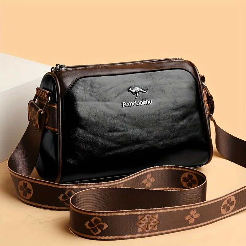 Elegant beige damväska med justerbar axelrem. Kompakt crossbody-design med god organisation.