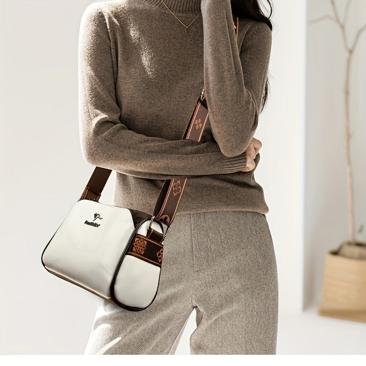 Grön crossbodyväska för dam, stilren accessoar med justerbar rem för optimal komfort.
