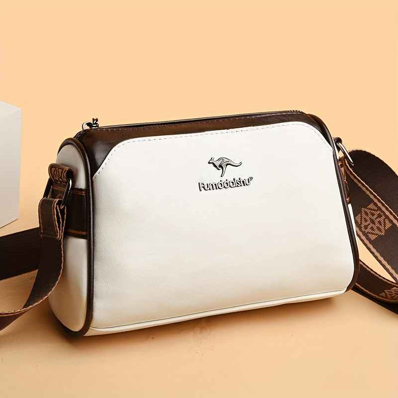 Modern grön crossbodyväska för dam med justerbar axelrem. Perfekt accessoar för stilmedvetna.