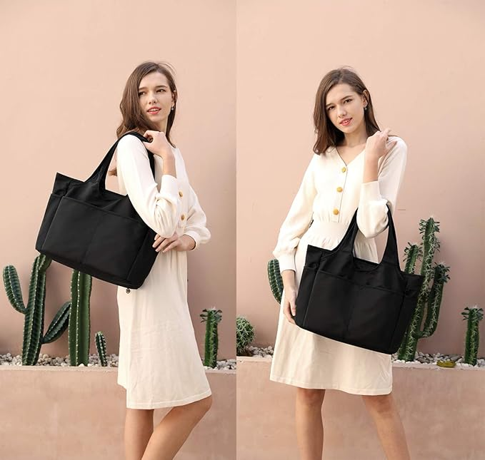 Elegant svart handväska/toteväska, idealisk för shopping eller casual användning. Mångsidig design.