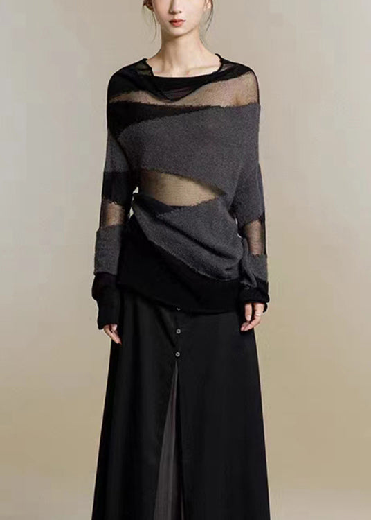 Elegant svart damtröja med tyllpatchworkdetaljer och hög krage, idealisk för kvinnors mode.